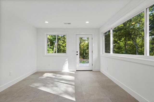 entryway featuring recessed lighting, visible vents, and baseboards