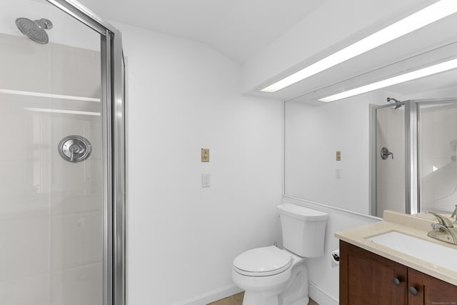 bathroom with lofted ceiling, a shower stall, toilet, and vanity