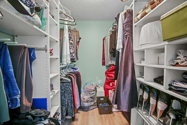 spacious closet featuring wood finished floors