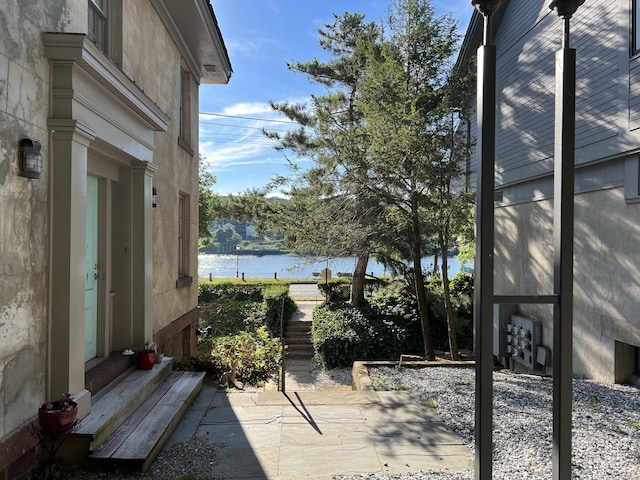 view of patio with a water view