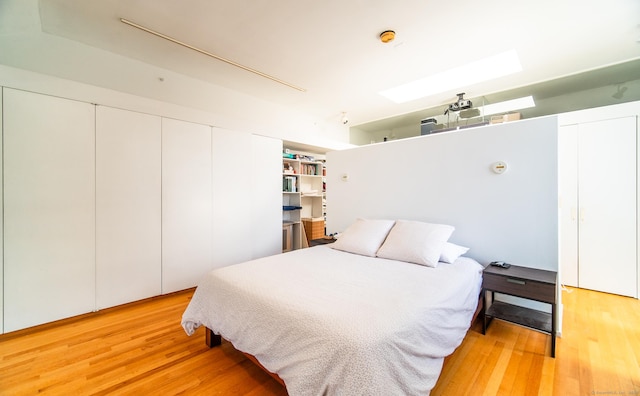 bedroom featuring light wood finished floors