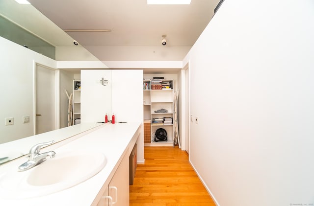 bathroom featuring vanity and wood finished floors