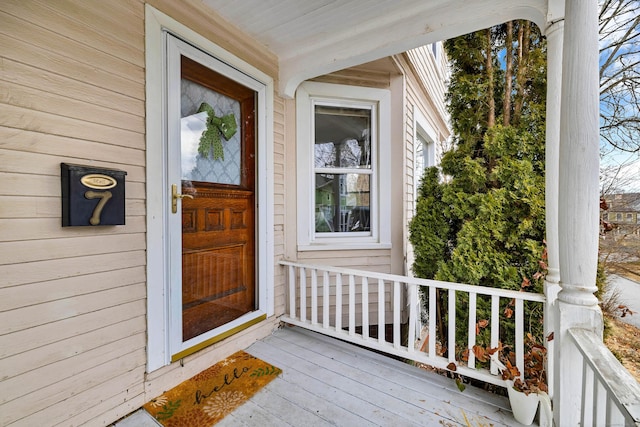 property entrance with covered porch