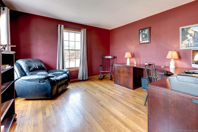 home office featuring baseboards and light wood-style floors