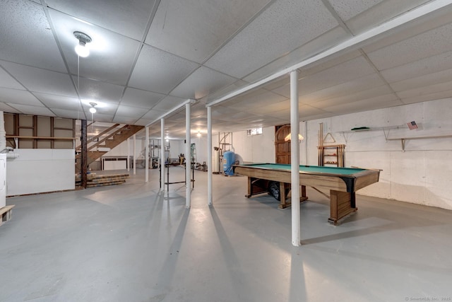 game room featuring pool table, finished concrete flooring, and a drop ceiling