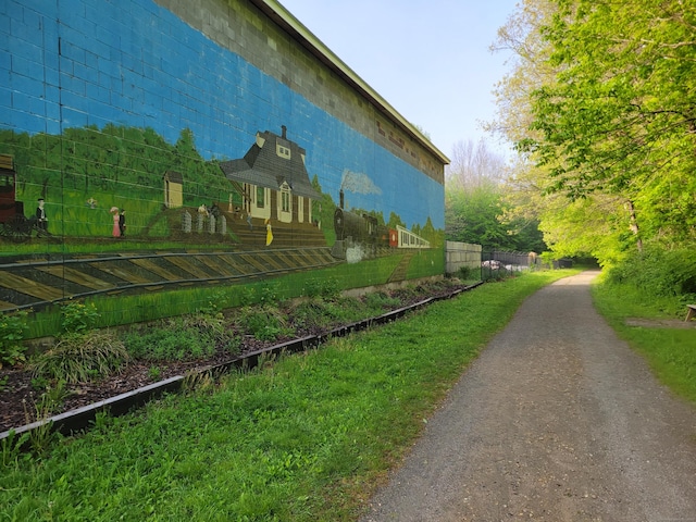 view of side of property featuring fence