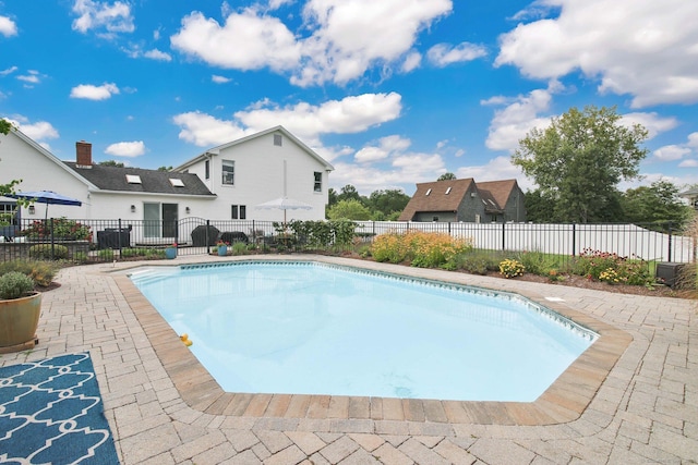 view of pool with fence, a fenced in pool, and a patio