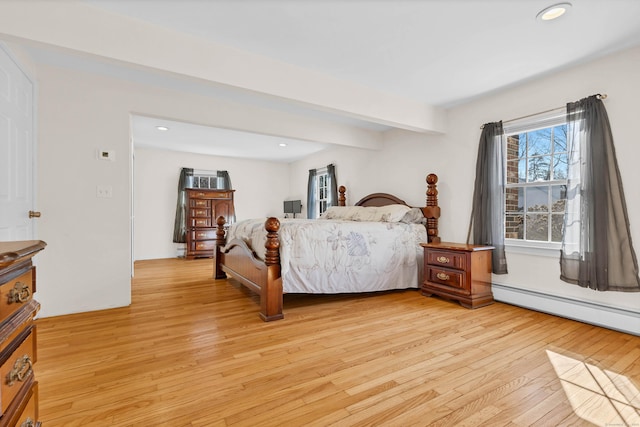 bedroom featuring light wood-style flooring, baseboard heating, beam ceiling, and recessed lighting