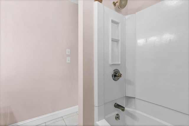 bathroom featuring baseboards, bathing tub / shower combination, and tile patterned floors