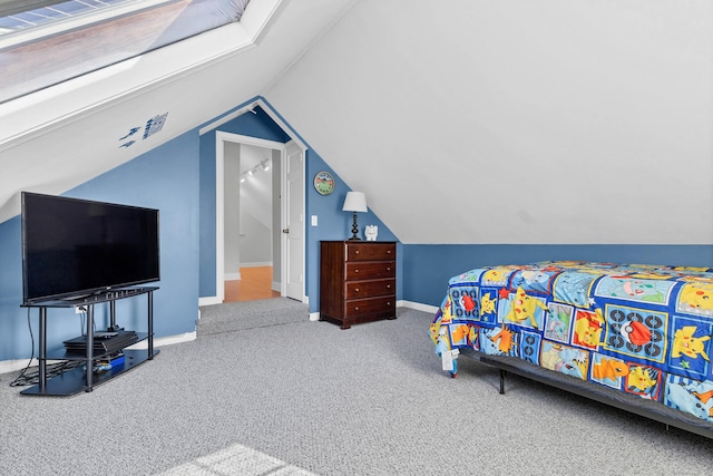 carpeted bedroom featuring lofted ceiling and baseboards