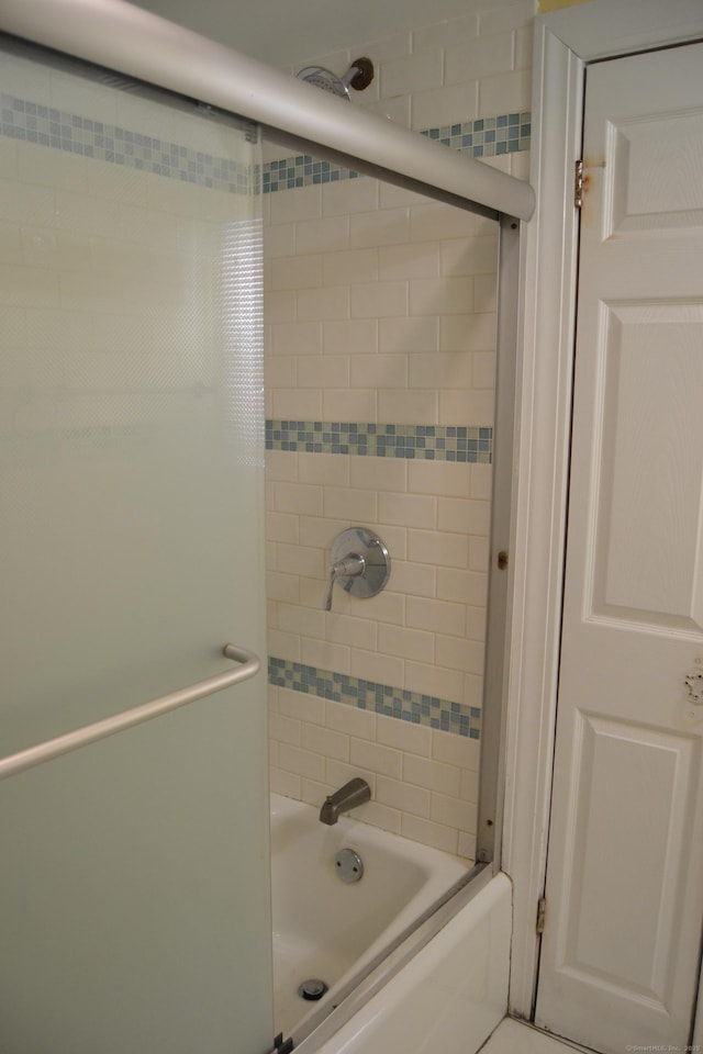 bathroom featuring enclosed tub / shower combo