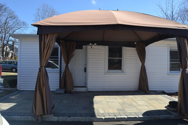 exterior space with a patio area and a gazebo