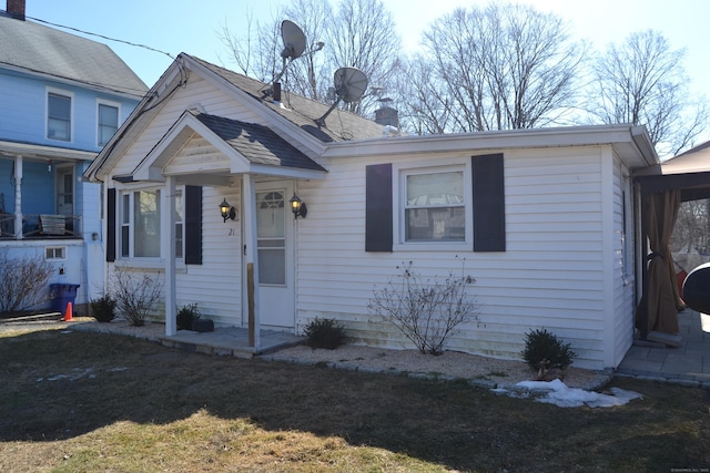 bungalow-style house with a chimney