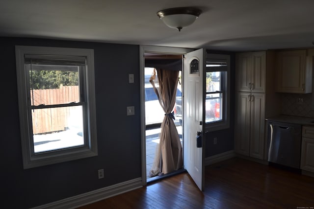 entrance foyer featuring dark wood-style floors and baseboards