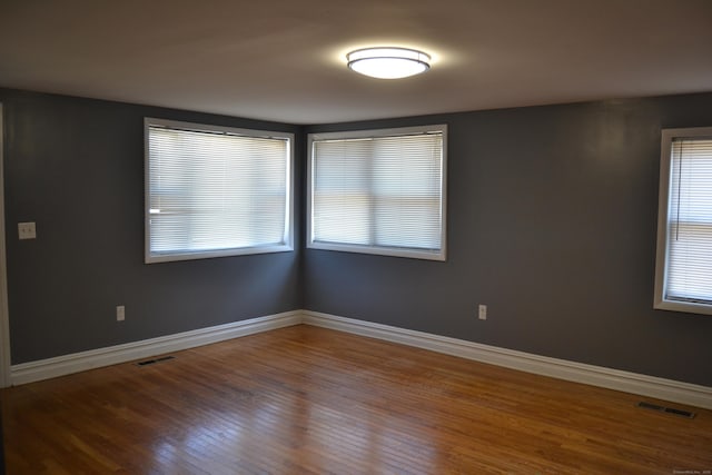 spare room with visible vents and baseboards