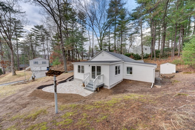 exterior space featuring an outbuilding and a patio area