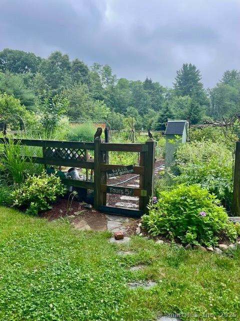 view of gate with fence