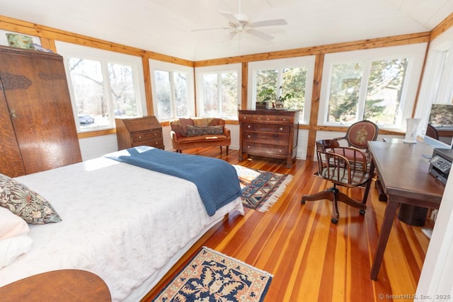 bedroom featuring vaulted ceiling and wood finished floors