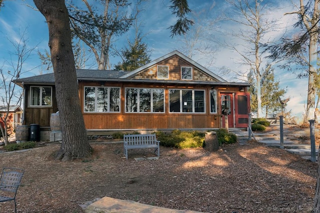 chalet / cabin with a sunroom