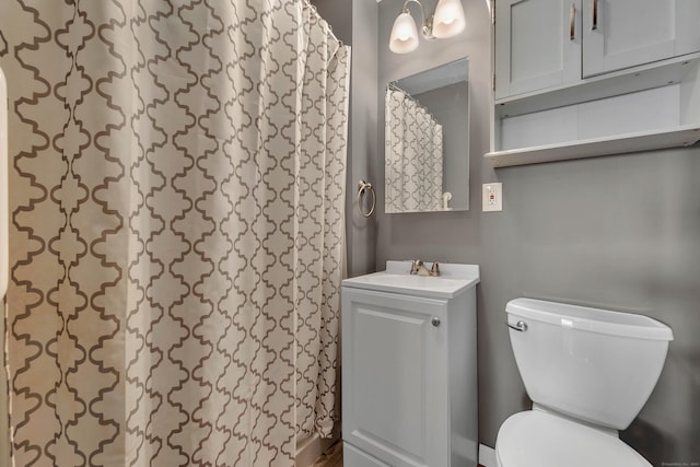 bathroom featuring toilet and vanity