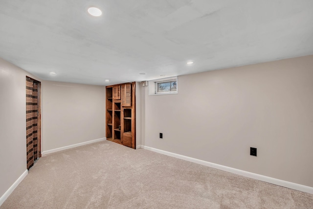 below grade area featuring recessed lighting, carpet, and baseboards