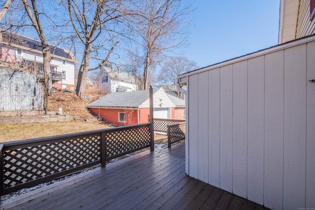 wooden terrace featuring an outdoor structure