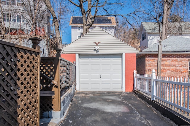 detached garage with aphalt driveway