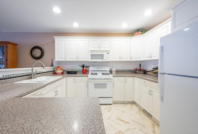 kitchen featuring white appliances, marble finish floor, white cabinets, and a sink