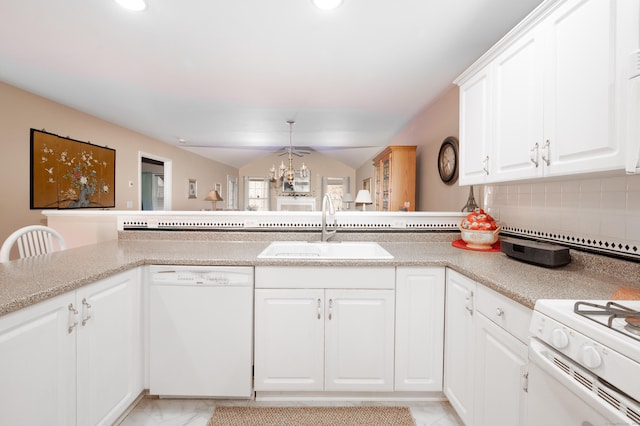 kitchen featuring marble finish floor, an inviting chandelier, white cabinetry, a sink, and white appliances