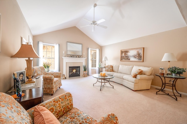 carpeted living area featuring lofted ceiling, a fireplace with flush hearth, a ceiling fan, and baseboards