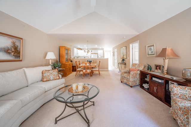 living room featuring light colored carpet and vaulted ceiling