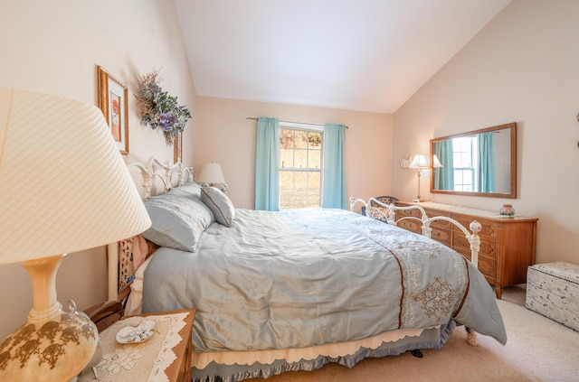 bedroom featuring lofted ceiling and light colored carpet