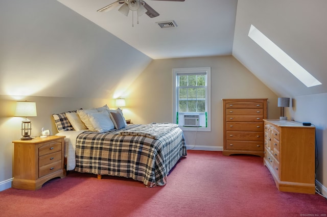 carpeted bedroom with visible vents, a ceiling fan, cooling unit, vaulted ceiling with skylight, and baseboards