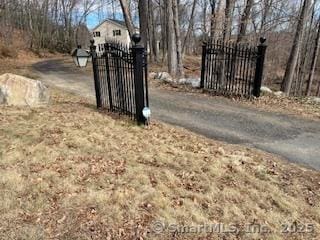 view of gate with fence