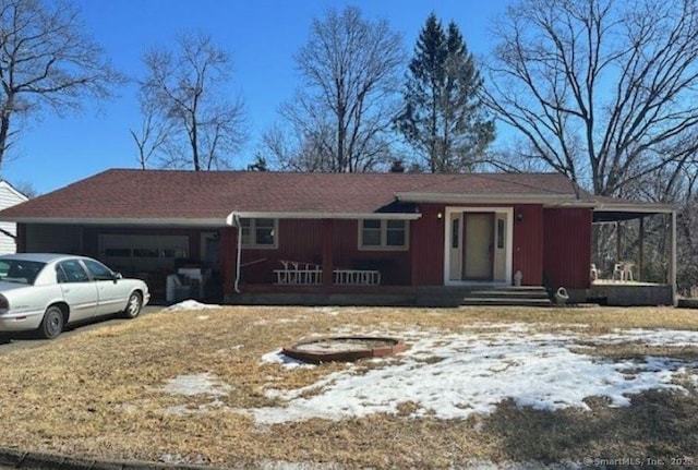 single story home with a garage and a porch