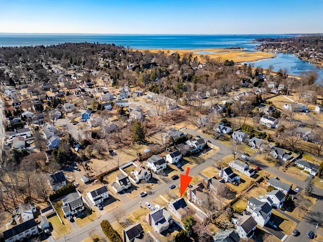 drone / aerial view with a water view and a residential view