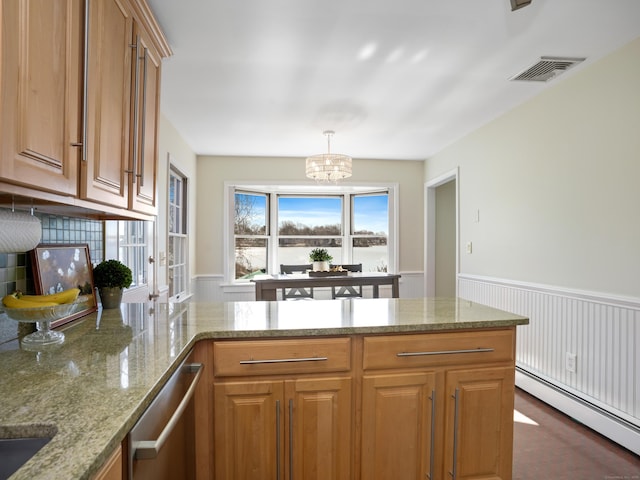 kitchen featuring light stone counters, a wainscoted wall, visible vents, a baseboard radiator, and stainless steel dishwasher