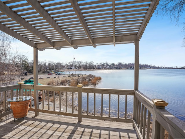 deck featuring a pergola and a water view