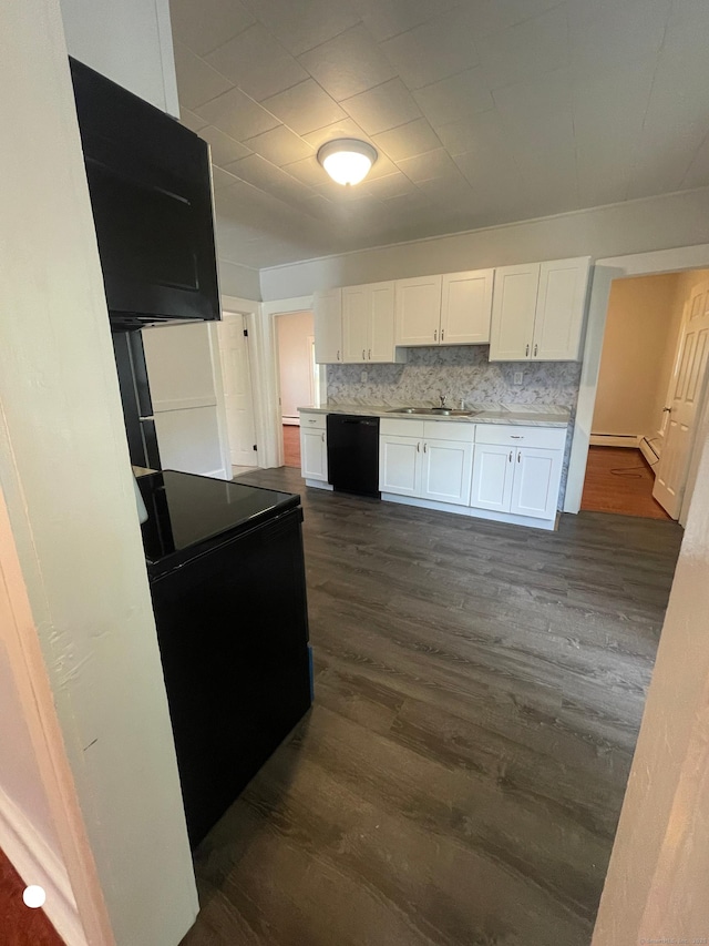 kitchen featuring black appliances, dark wood-type flooring, backsplash, and white cabinetry