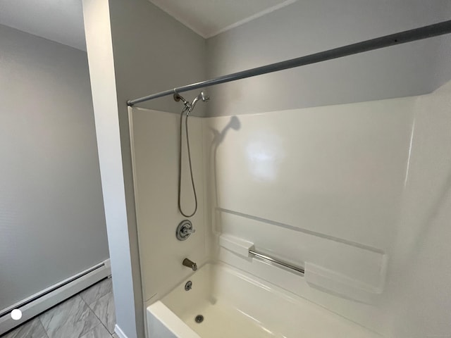 full bathroom with marble finish floor, bathtub / shower combination, and baseboard heating