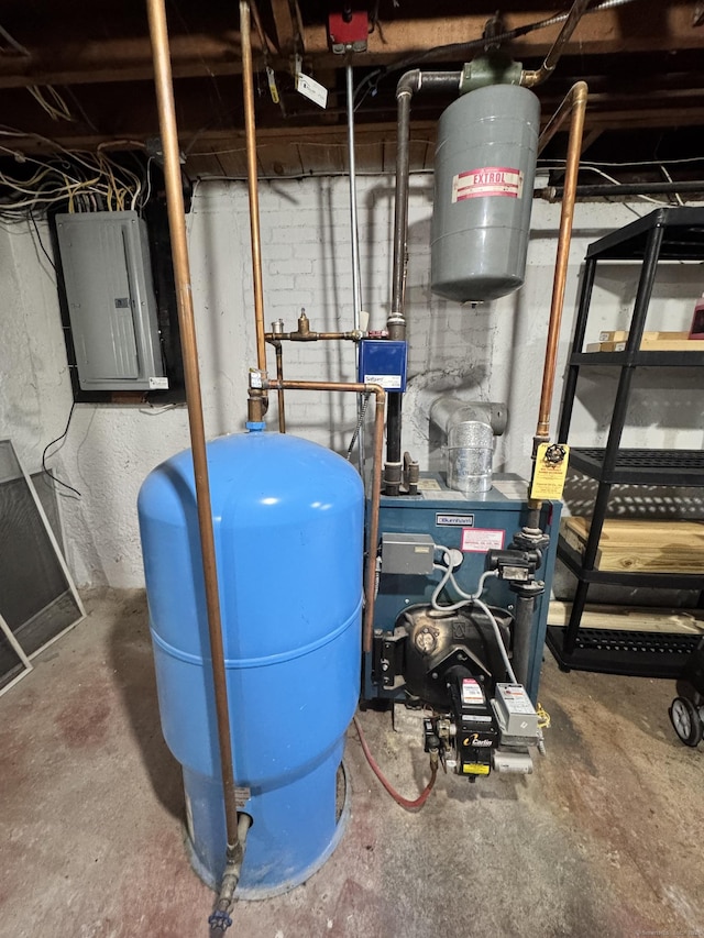 utility room featuring a heating unit and electric panel