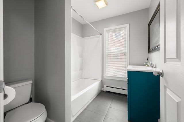 bathroom with toilet, tile patterned flooring, vanity, a baseboard heating unit, and shower / bathing tub combination