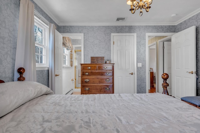 bedroom with ornamental molding and wallpapered walls