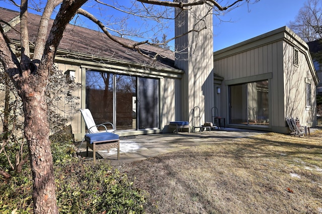 back of property featuring a patio area