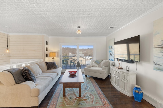 living area with baseboards, dark wood-style flooring, visible vents, and crown molding