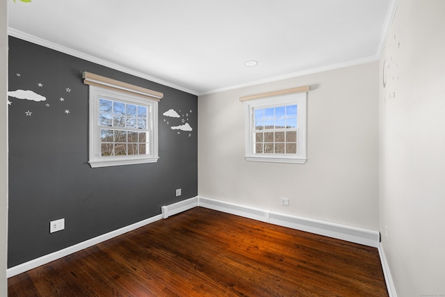 unfurnished room featuring plenty of natural light, baseboards, and wood finished floors