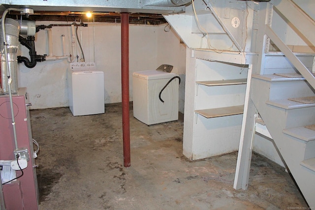 unfinished below grade area with washing machine and dryer