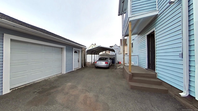 exterior space featuring a carport and driveway