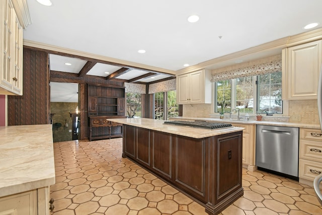 kitchen featuring tasteful backsplash, stainless steel appliances, cream cabinetry, beam ceiling, and recessed lighting