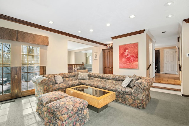 carpeted living area with stairs, visible vents, ornamental molding, and recessed lighting